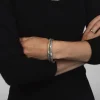 Embossed Hinged Cuffling in Silver and Brass
