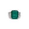 Three Stone Emerald Ring in Platinum with Diamond Trapezoid Side Stones