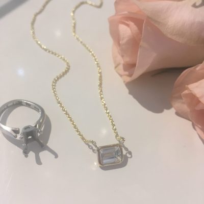 The stone was so stunning that we wanted to keep it simple, using a thin bezel setting for the stone.  The pendant looks like it's floating on the skin.  We fell in love.